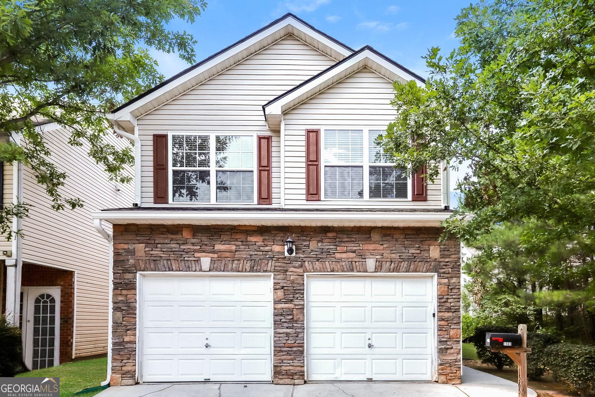 a front view of a house with a garage