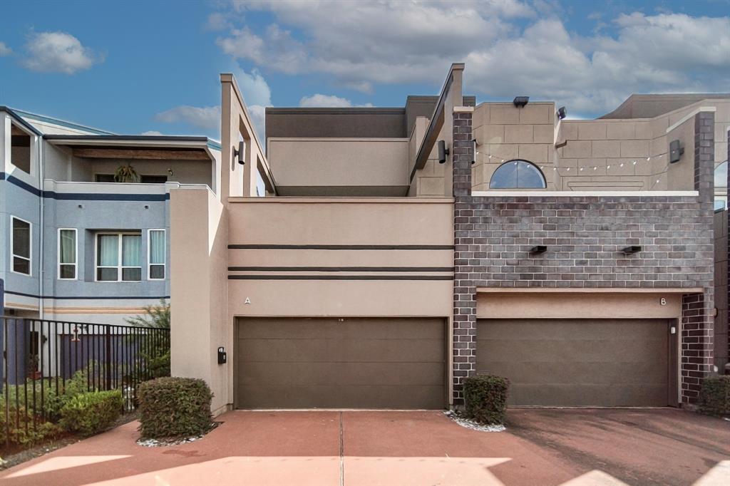 a front view of a house with garage