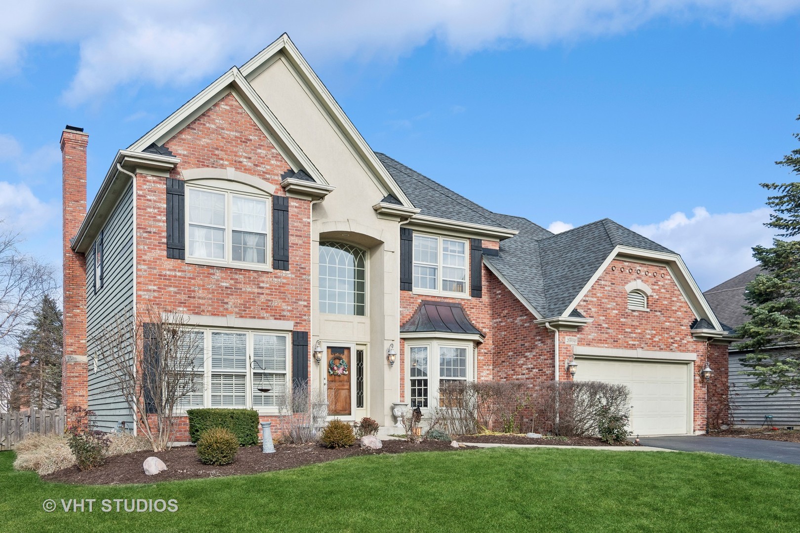 front view of a house with a yard