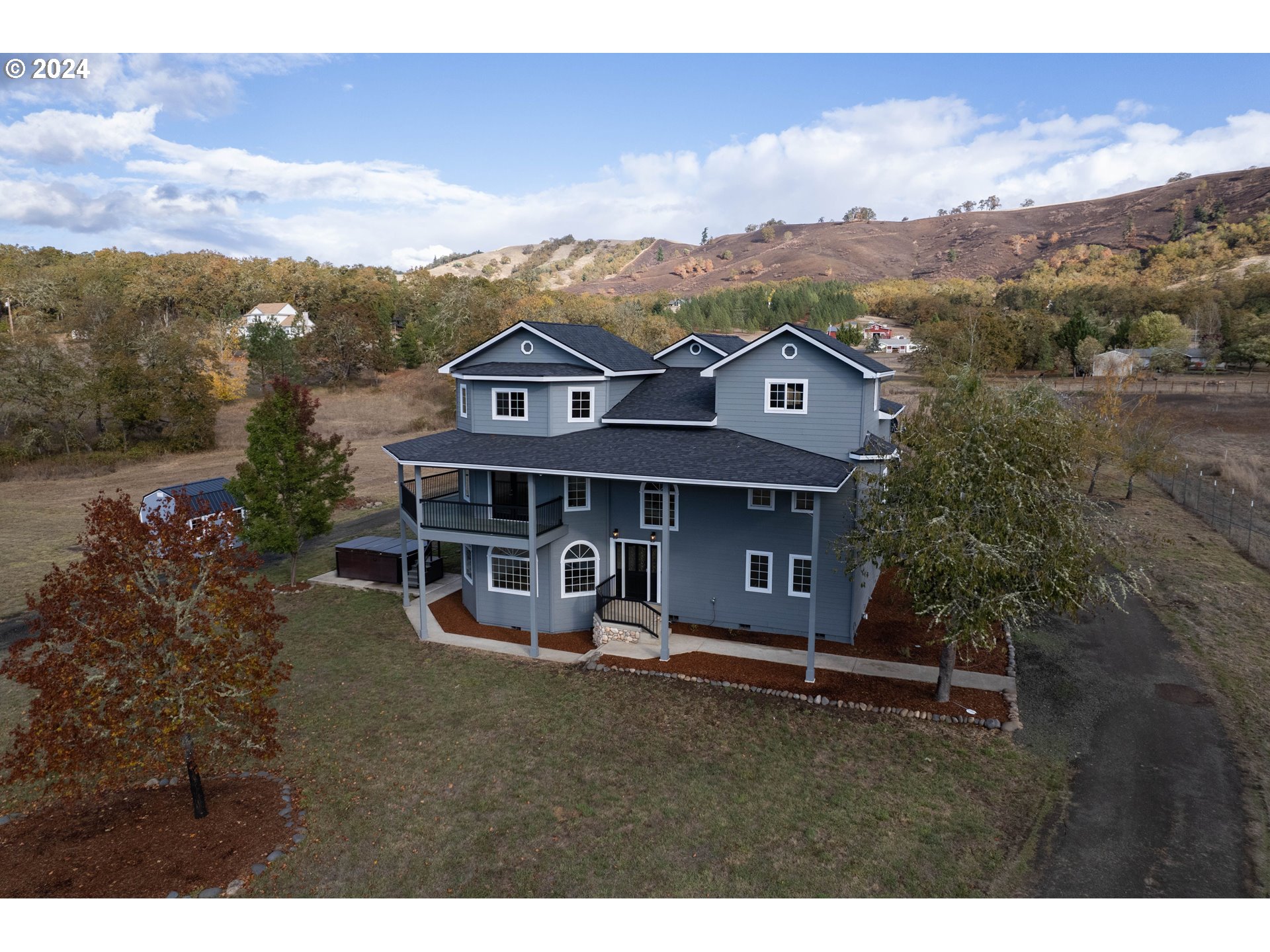 a view of a house with a mountain in the background