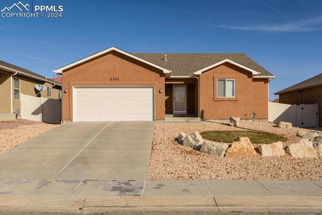 Single story home featuring a garage