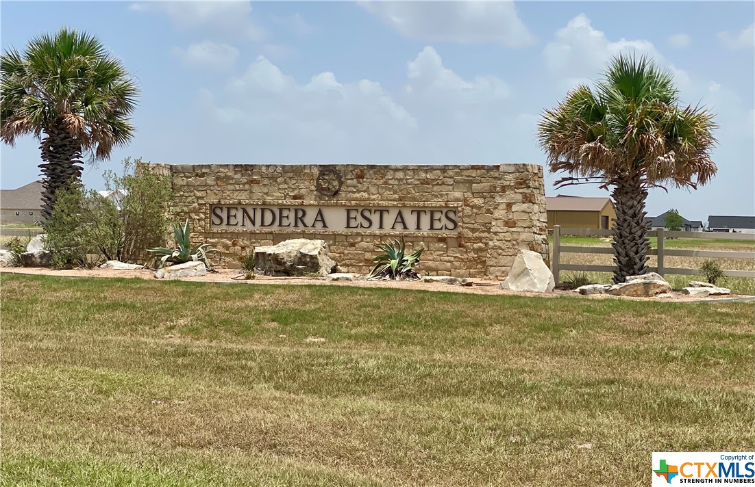 a view of a sign board with ocean view