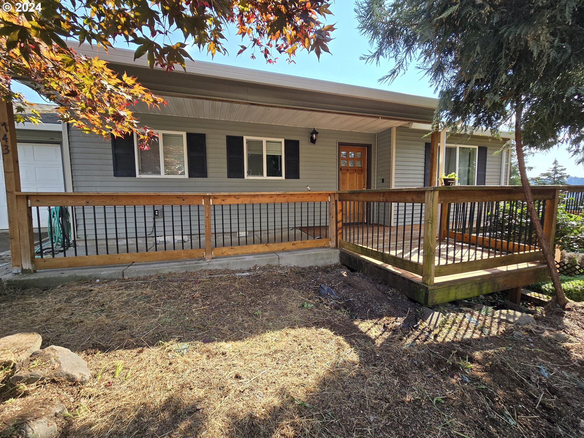 a view of a house with a yard