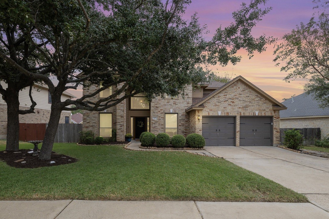 Stunning curb appeal with large tree's