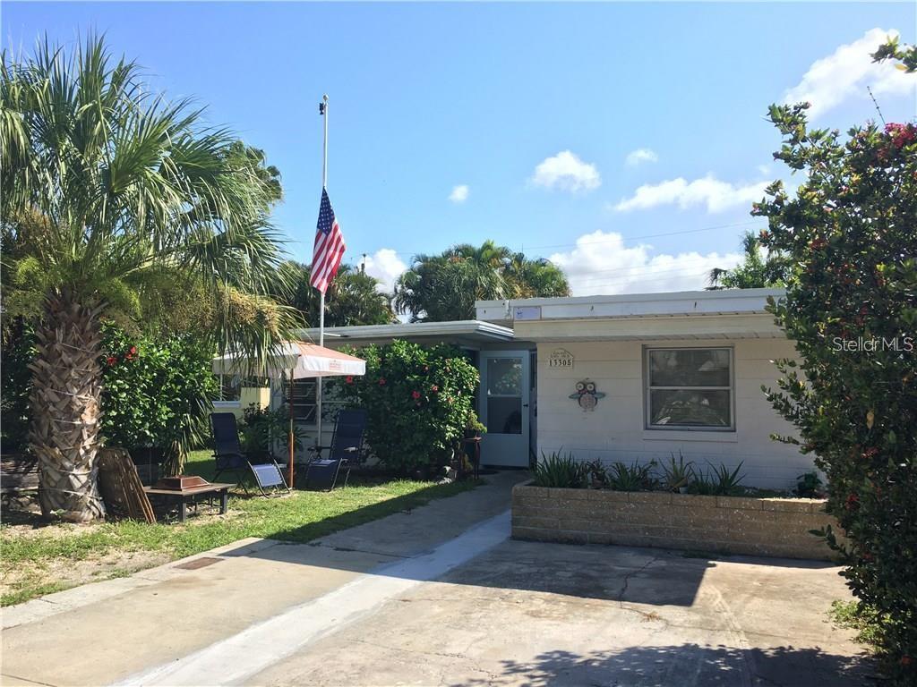 a front view of a house with yard