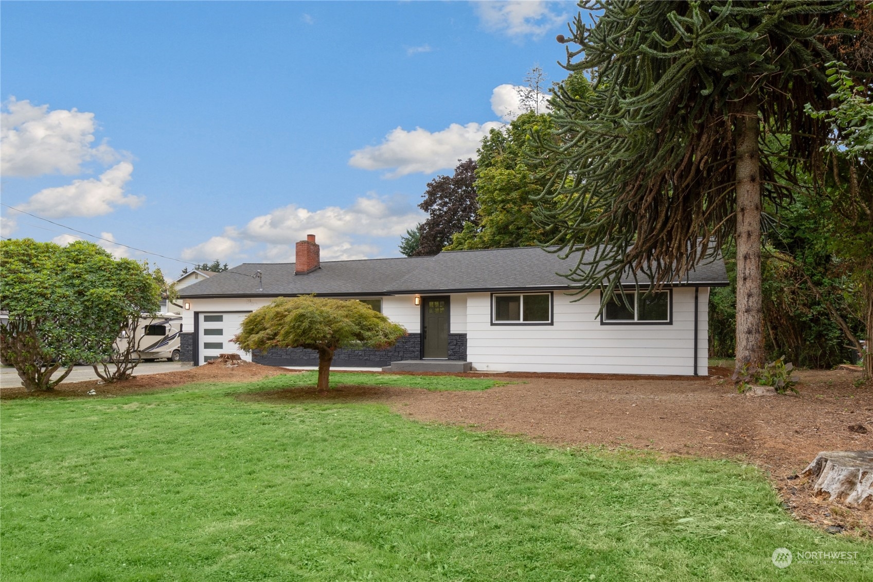 a house view with a garden space