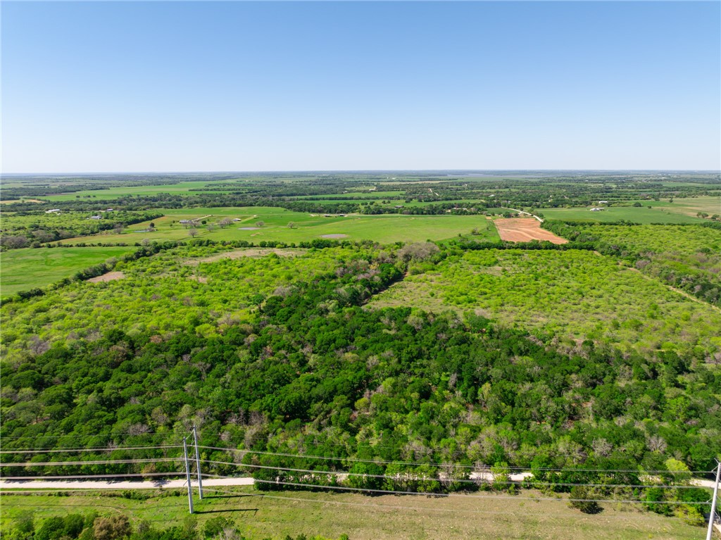 a view of a field with an outdoor space