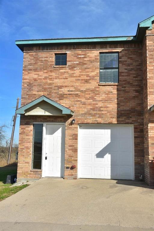 a front view of a house with garage