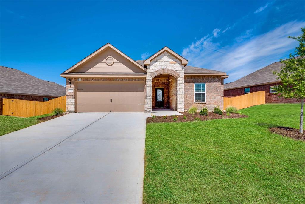 a front view of a house with yard