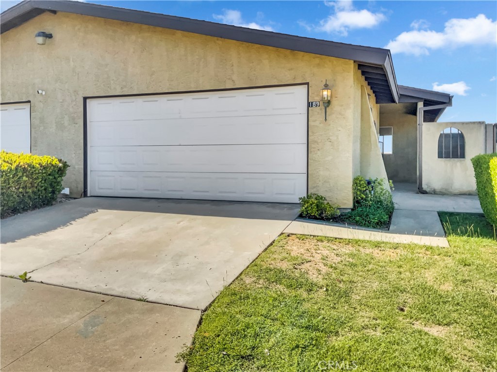 a view of backyard with garage