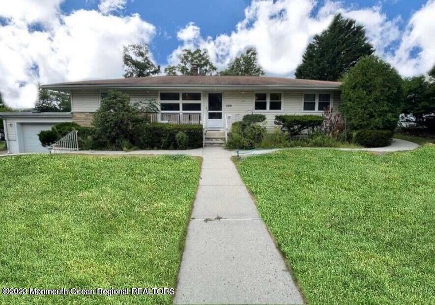 a view of an house with backyard space and garden