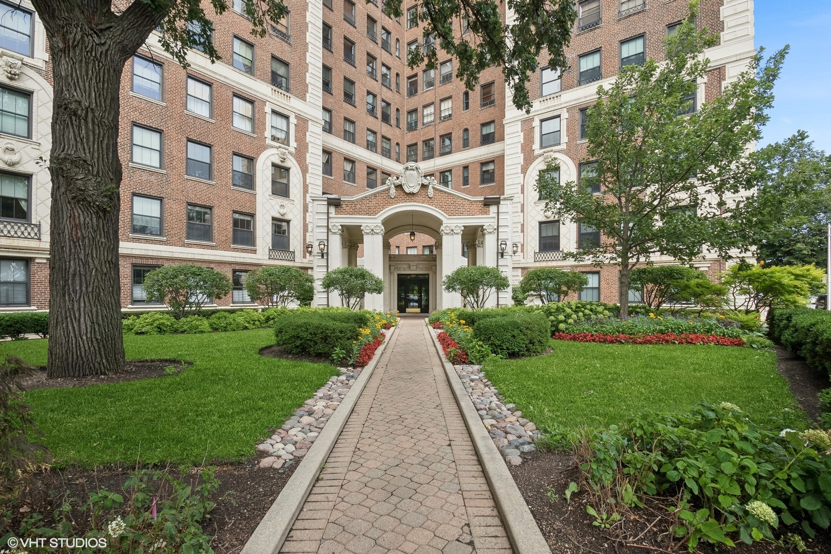 a front view of a building with garden