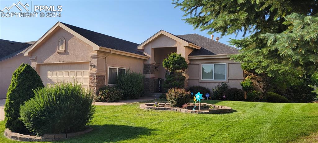 a front view of a house with a yard and porch