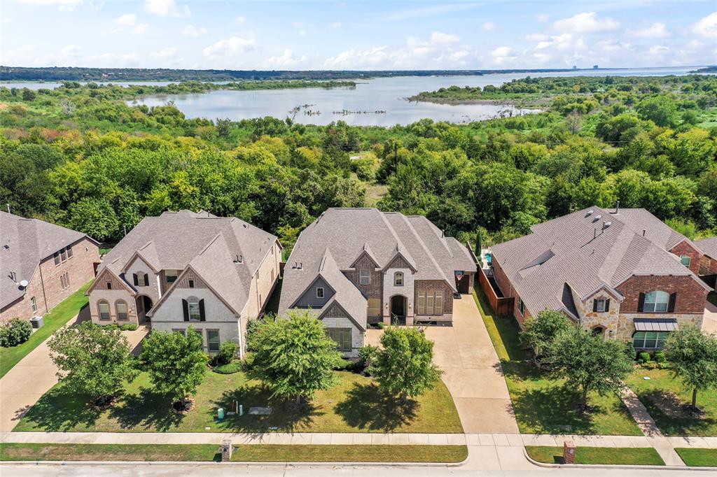 an aerial view of a house with garden space and outdoor seating