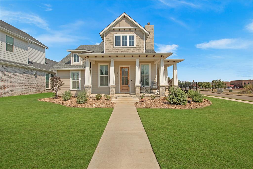 a front view of a house with swimming pool garden and patio