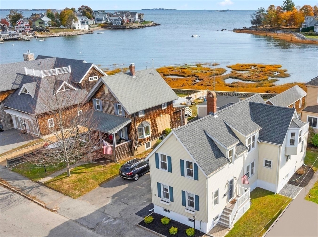 an aerial view of a house with lake view