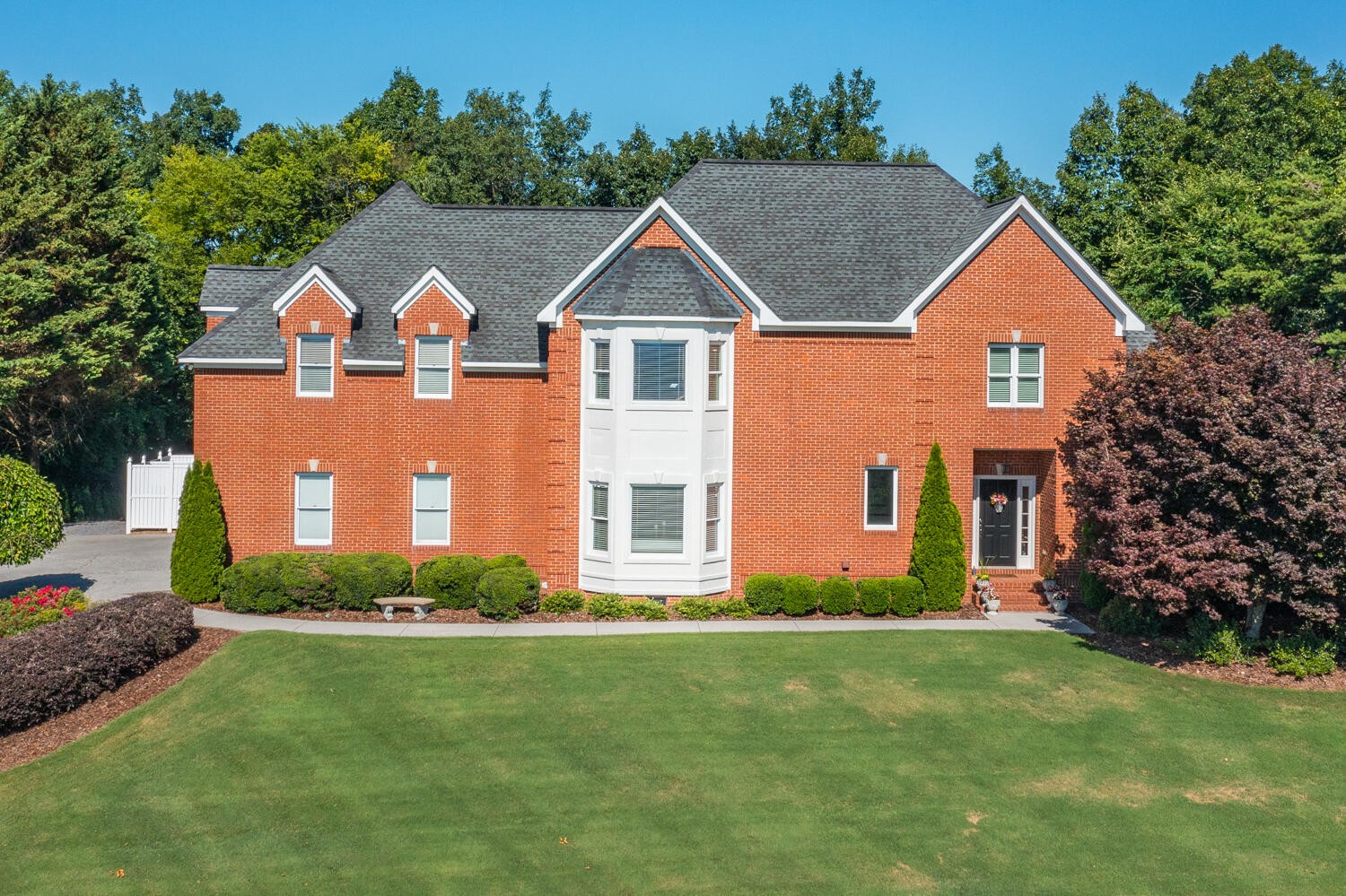 a front view of a house with garden