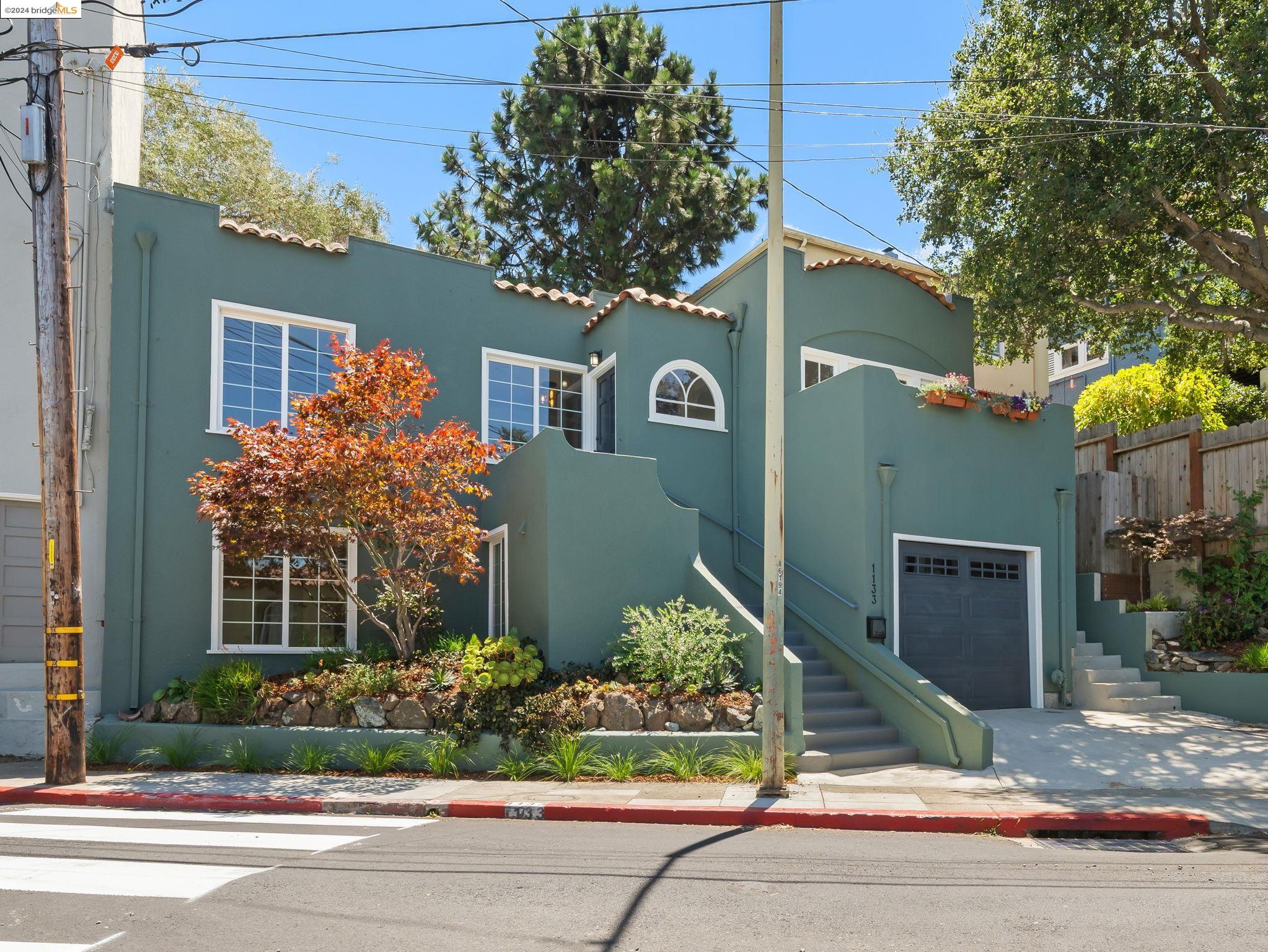 a front view of a house with garden