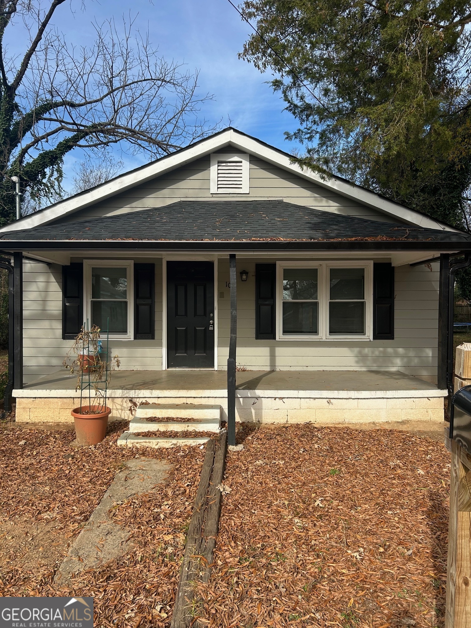 a front view of a house with a porch