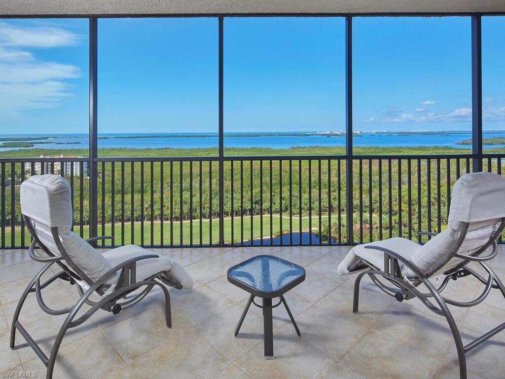 a chair and table in a balcony