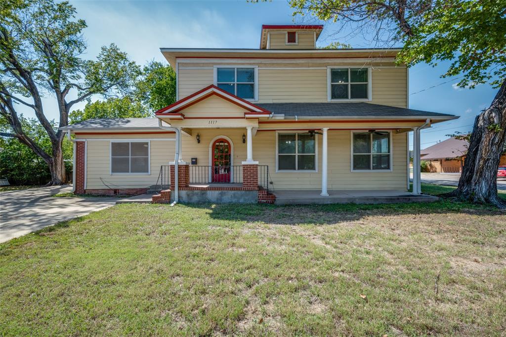 front view of a house with a yard