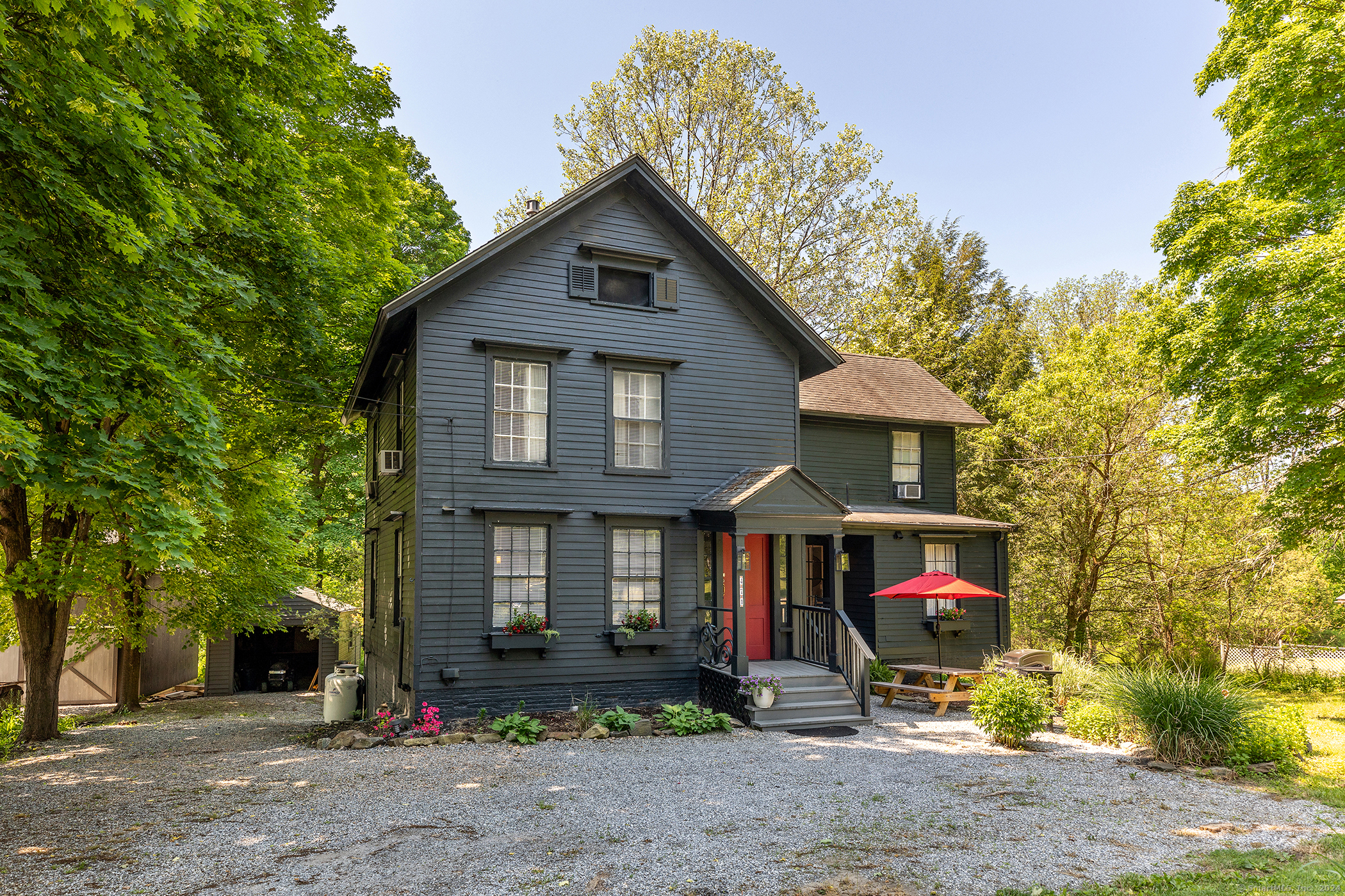 a front view of a house with garden