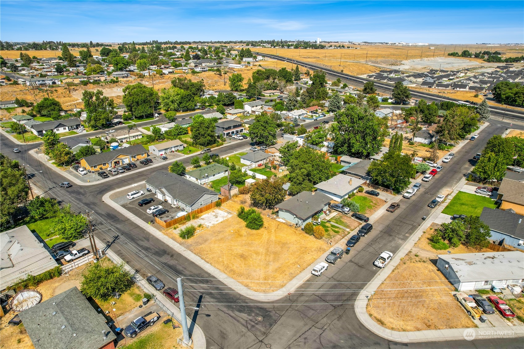 an aerial view of residential houses with outdoor space