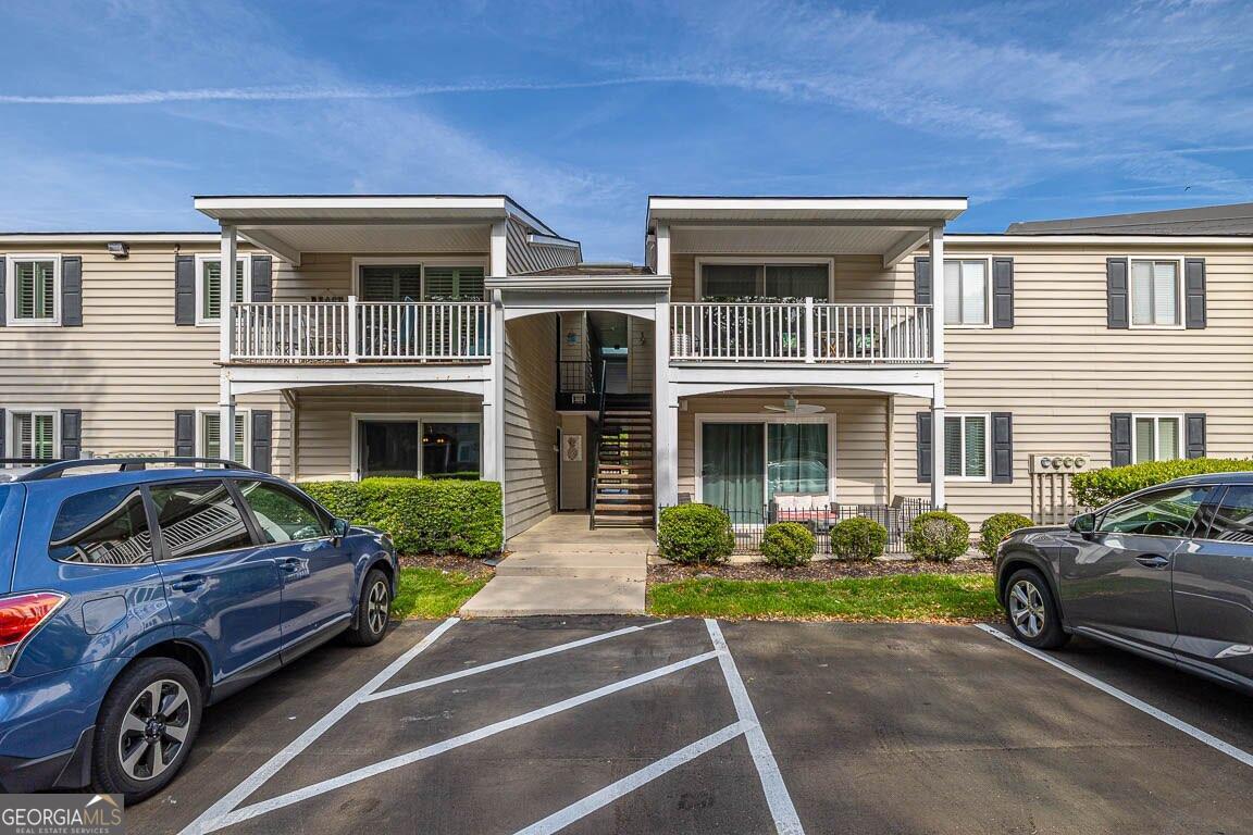 a front view of a house with parking space