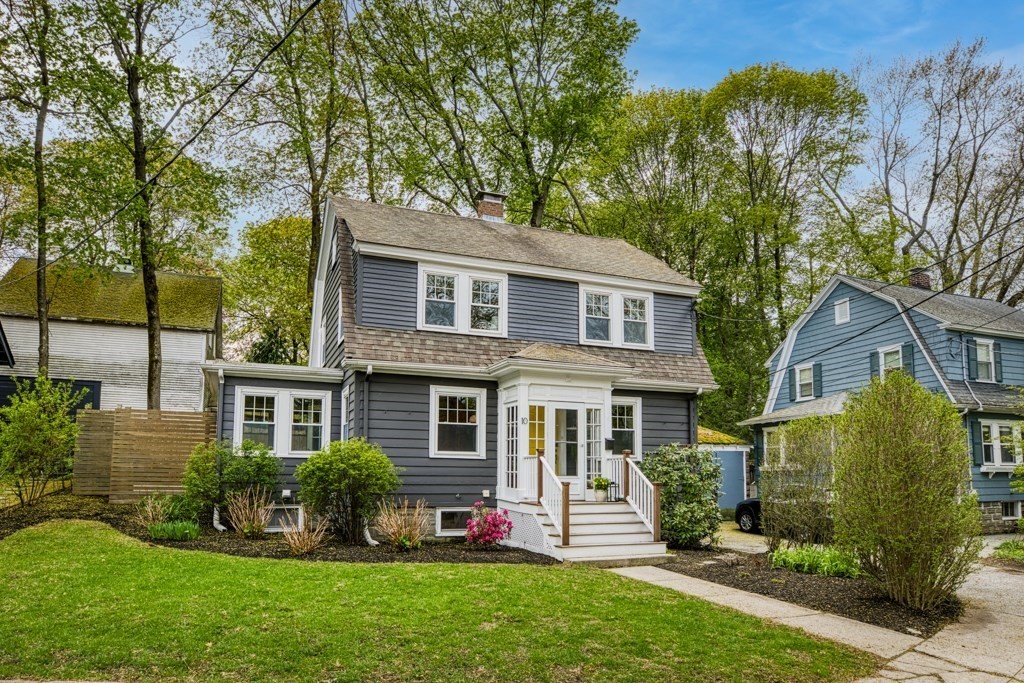 front view of a house with a yard