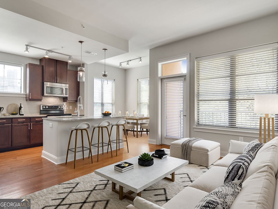 a living room with furniture and a table