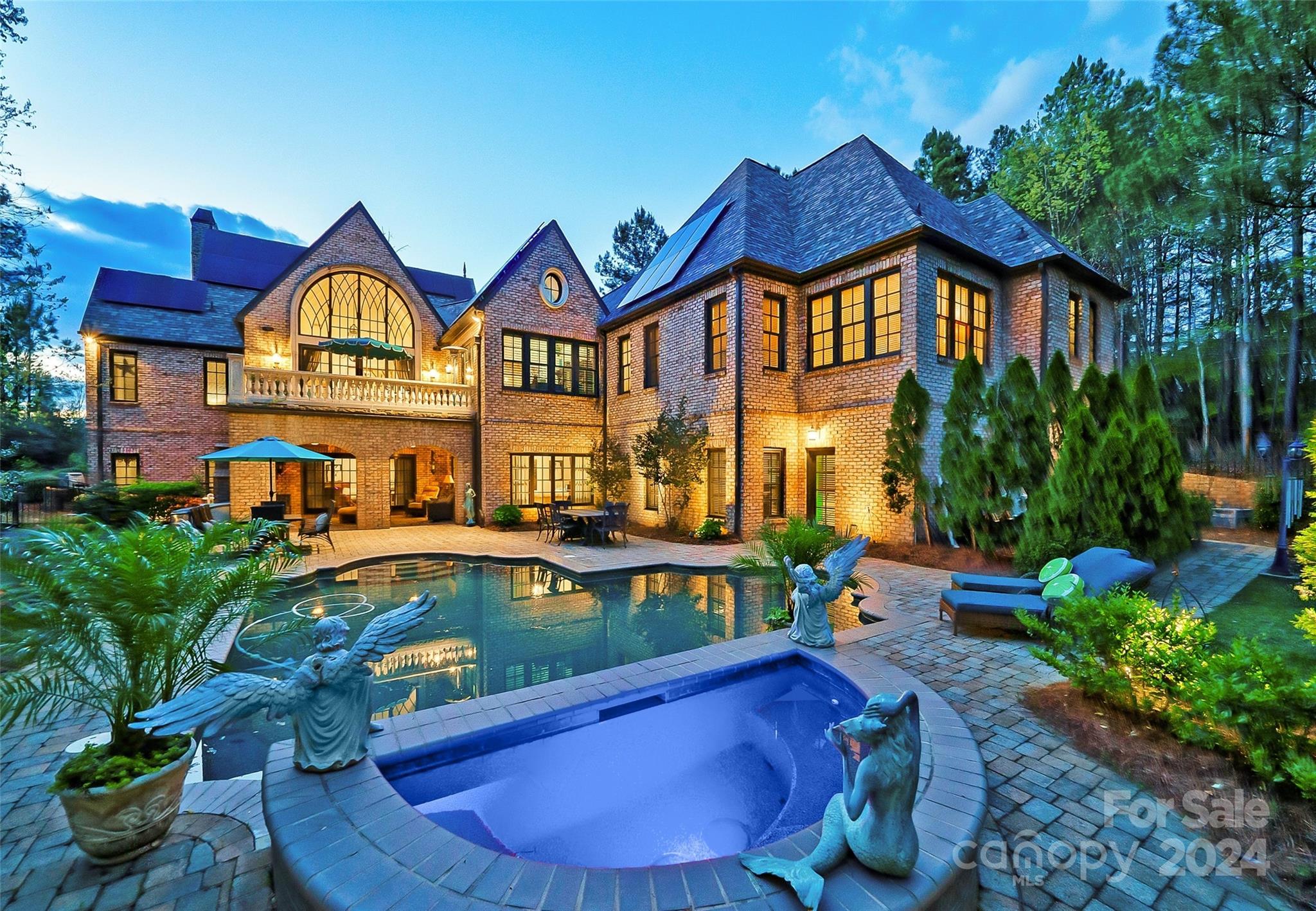 a aerial view of a house with swimming pool and sitting area