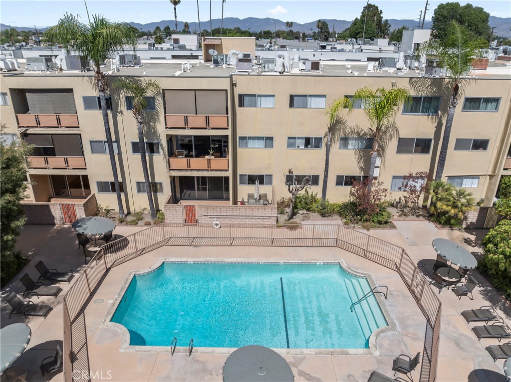 a view of a swimming pool with a patio