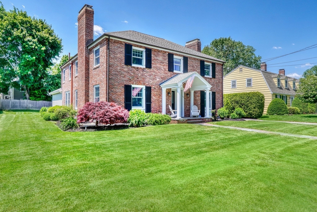 a front view of a house with a yard