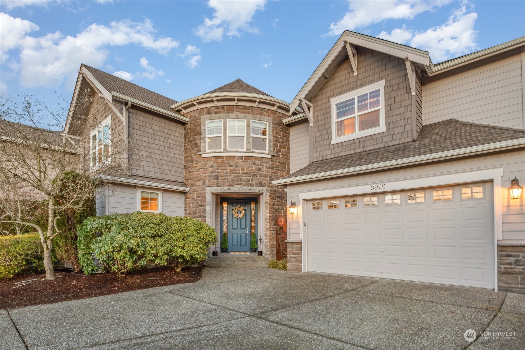 a front view of a house with a garage