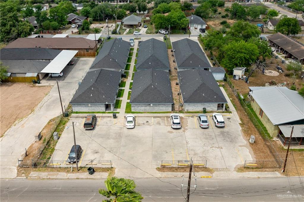 an aerial view of residential houses with outdoor space