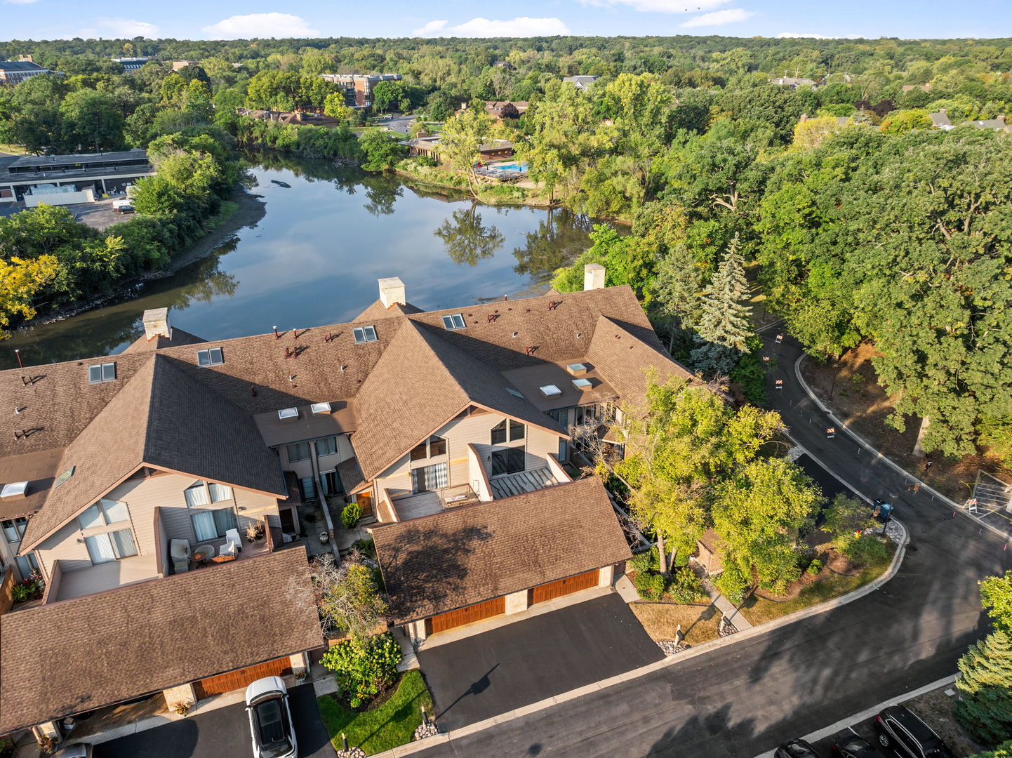 an aerial view of a house with a lake view