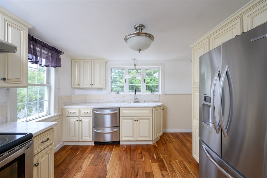 a kitchen with a stove and a refrigerator