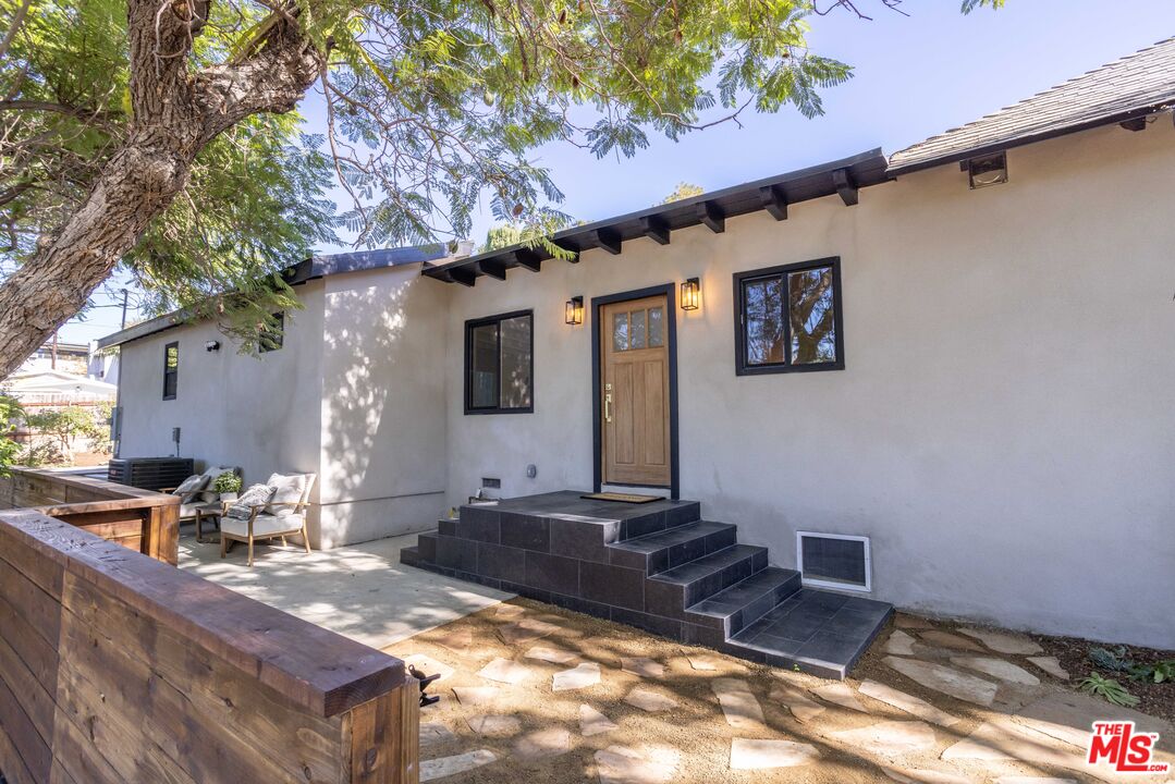 a backyard of a house with seating space