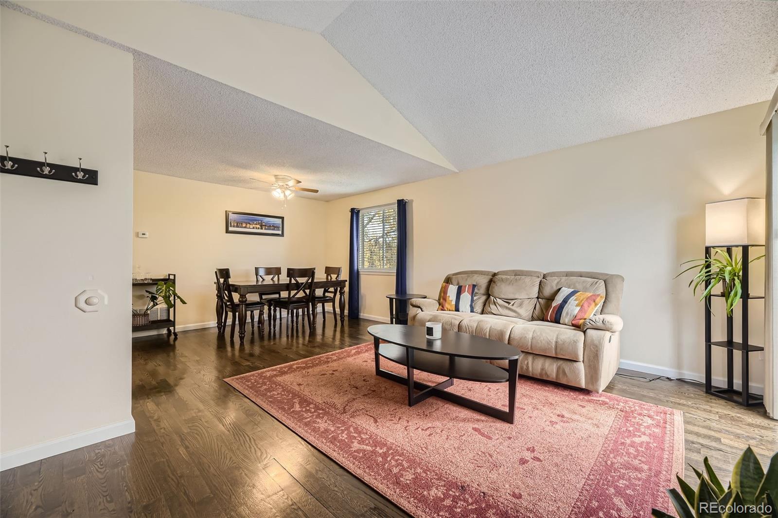 a living room with furniture and a table