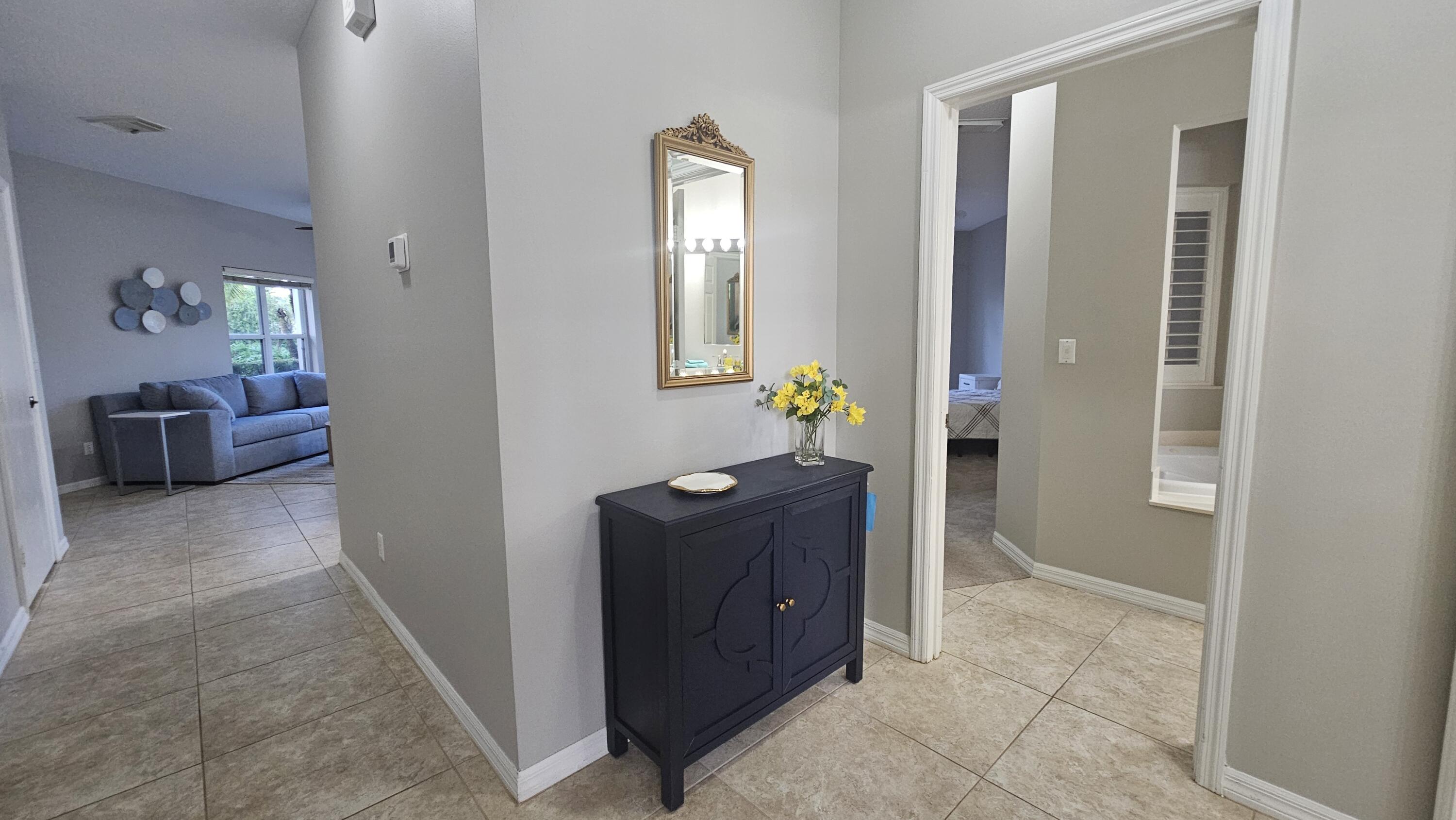 a view of an entryway with wooden floor