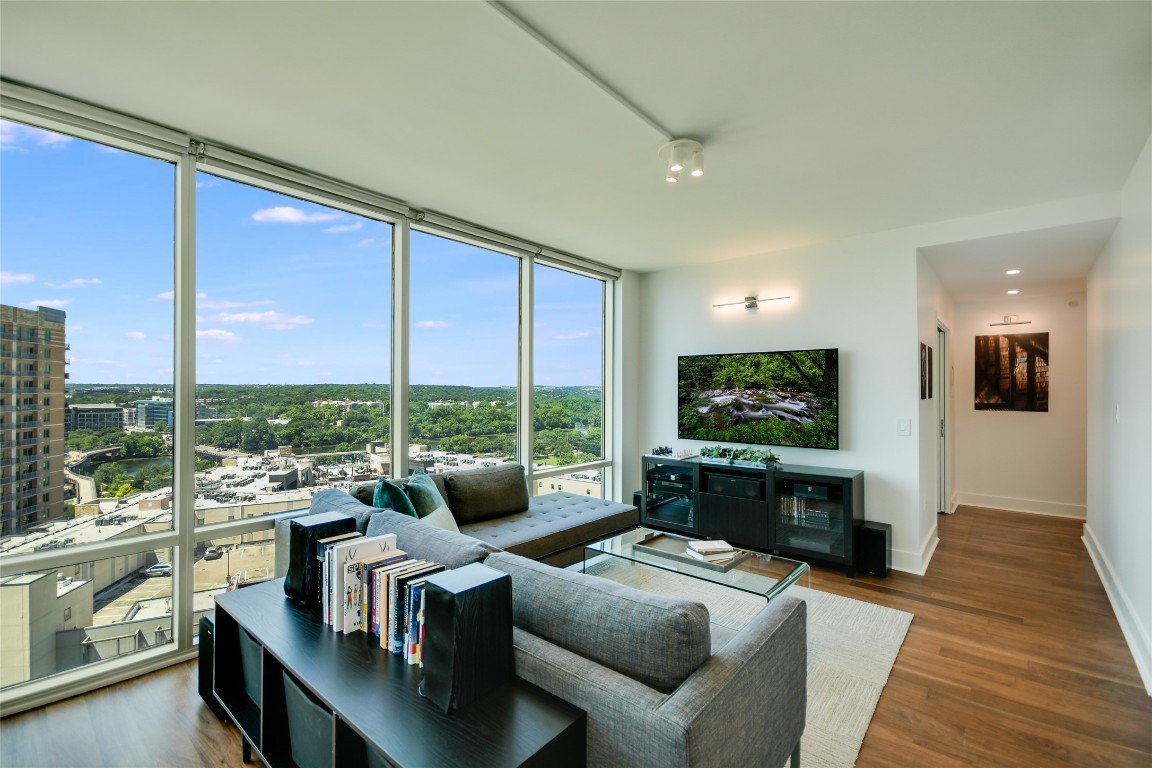 a living room with fireplace furniture and a flat screen tv