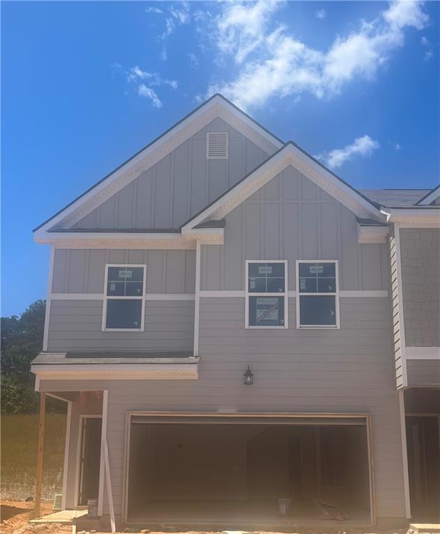 a front view of a house with a garage