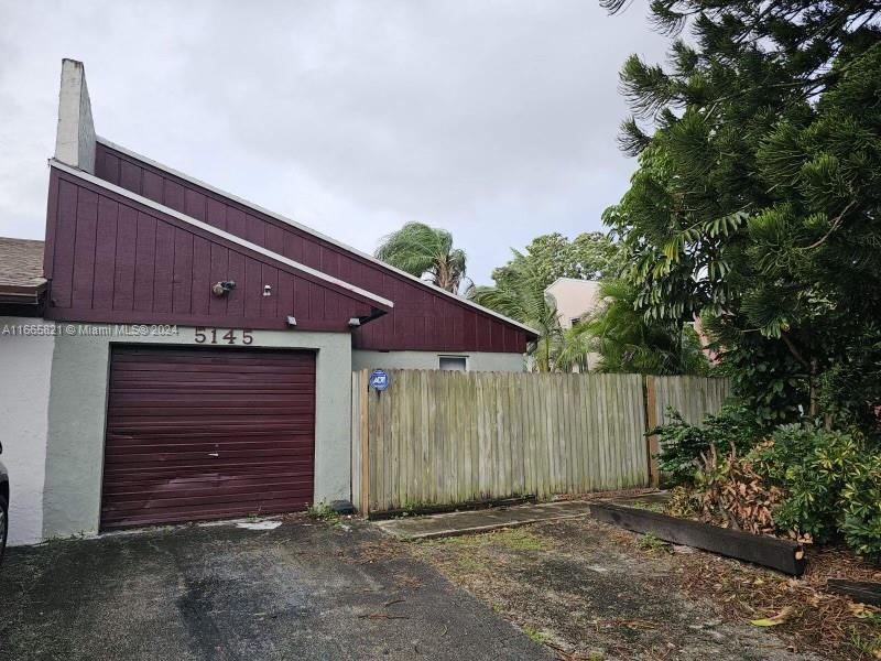 a front view of a house with a garage