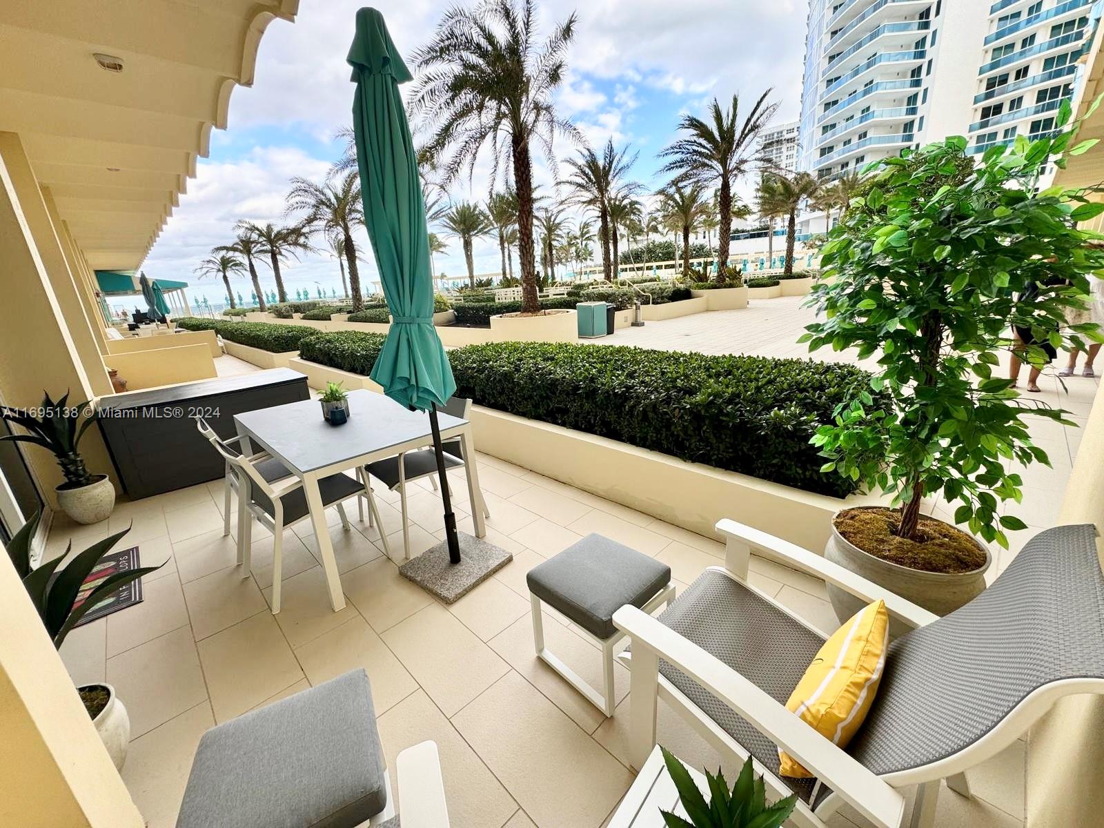 a view of a patio with swimming pool