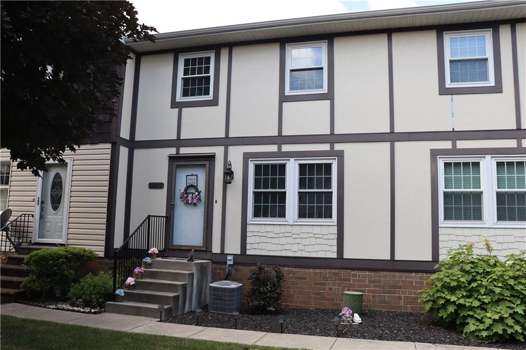 a front view of a house with windows