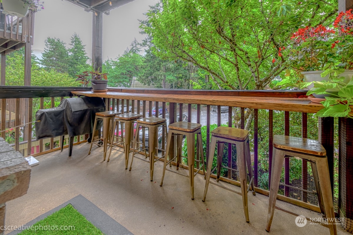 a view of a patio with a table and chairs