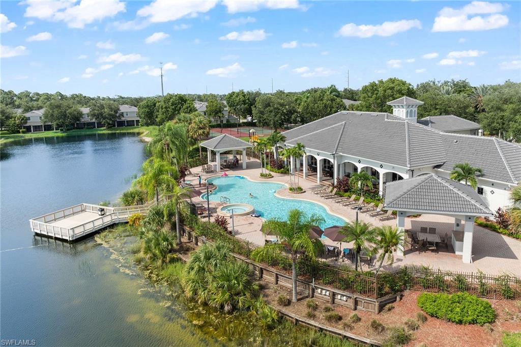 an aerial view of a house with a lake view