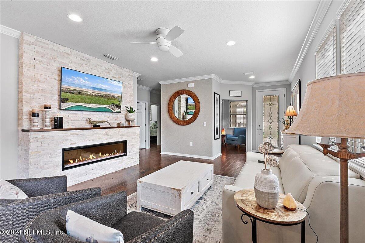 a living room with furniture a rug and a fireplace