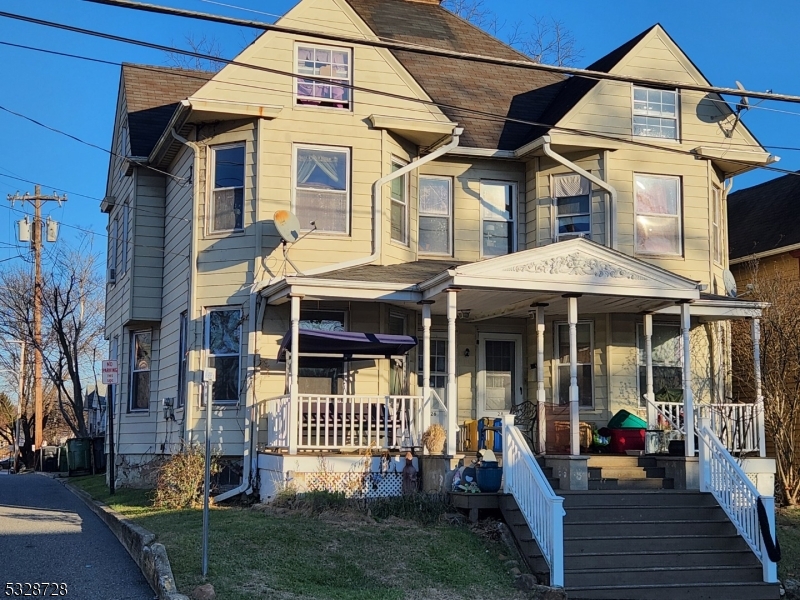 a front view of a house with a porch