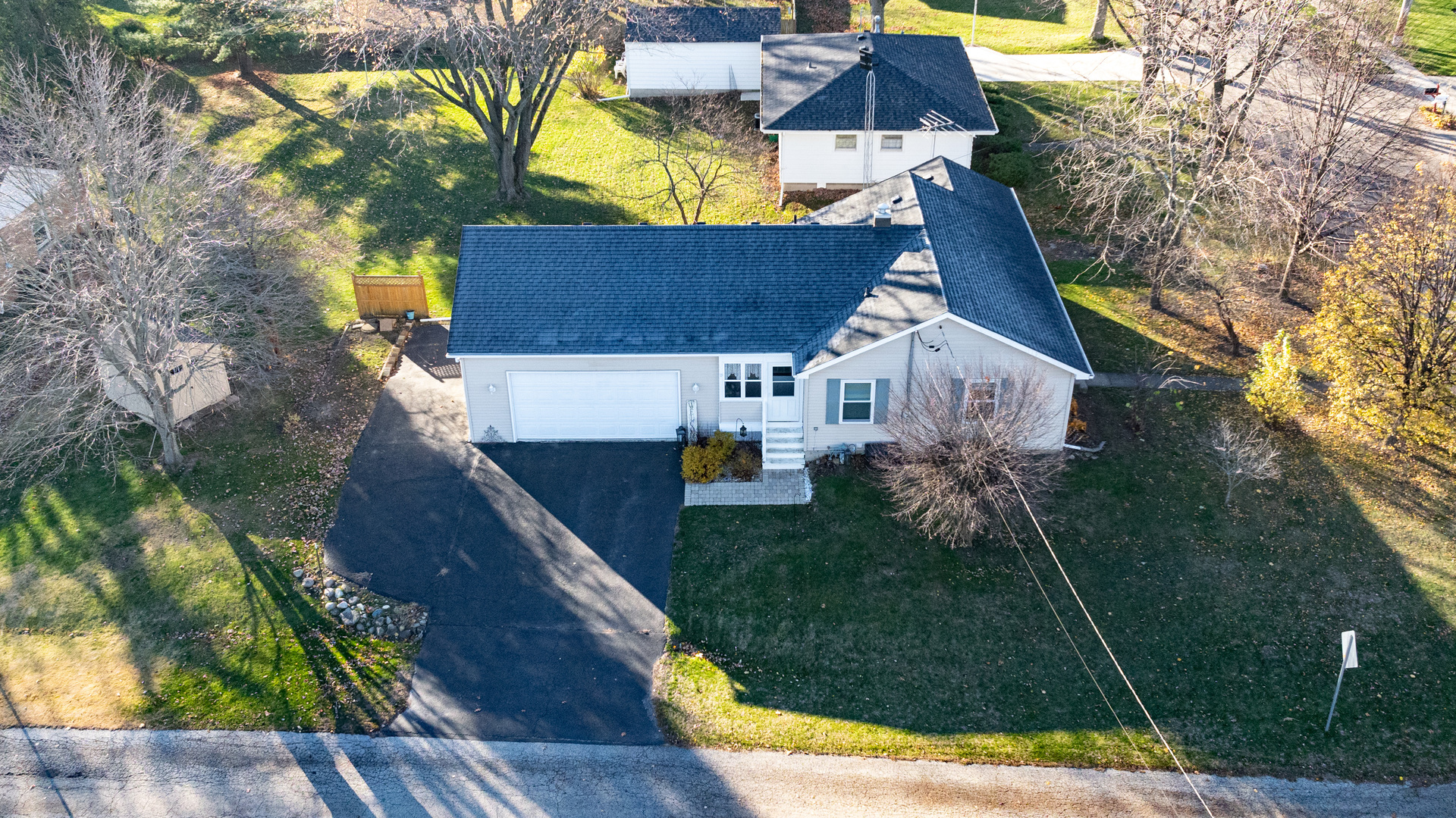 an aerial view of house with yard